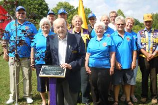 Bill Morton (centre) with members of the Sharbot Lake and District Lions was honored at a special tree and plaque dedication ceremony at the Railway Heritage Park in Sharbot Lake on September 1.